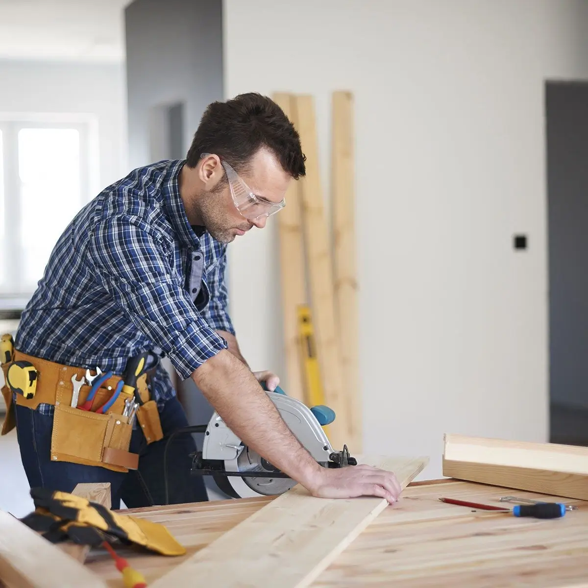 Master woodworker selecting materials
